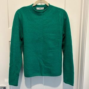 Green sweater.
